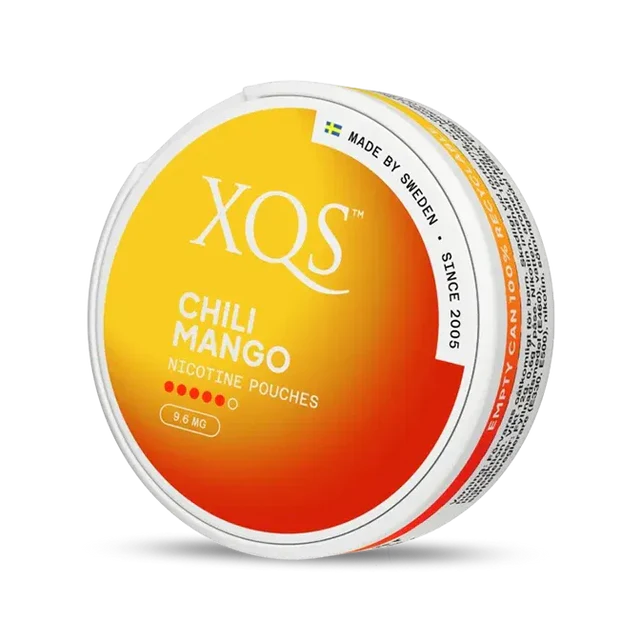 Close-up of XQS Chili Mango all white nicotine pouch can. Slim format, chili mango taste, modern vibrant packaging.