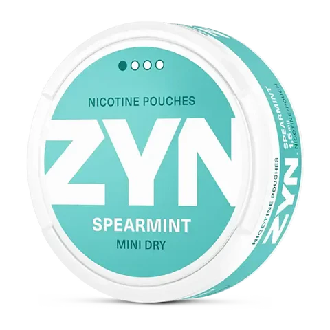 ZYN Spearmint Mini Dry nicotine pouch can. Green and white design, all white mini pouch with dry spearmint flavor. Discreet and refreshing.
