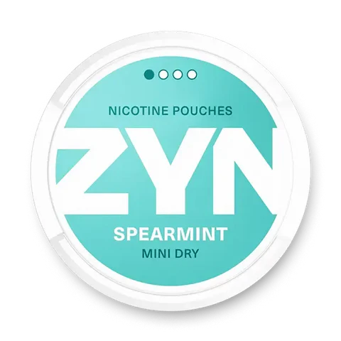 ZYN Spearmint Mini Dry nicotine pouch can. Green and white design, all white mini pouch with dry spearmint flavor. Discreet and refreshing.