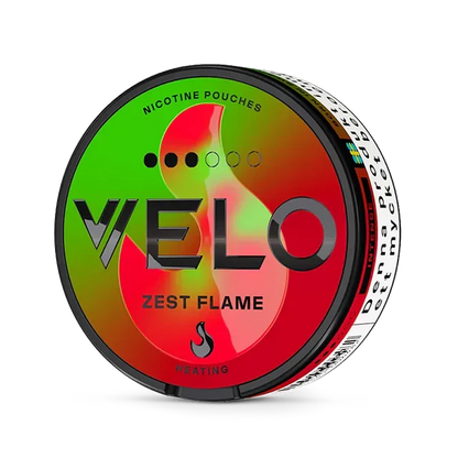 Close-up of Velo Zest Flame Slim all white nicotine pouch can. Slim format, zest flame taste, modern vibrant packaging.