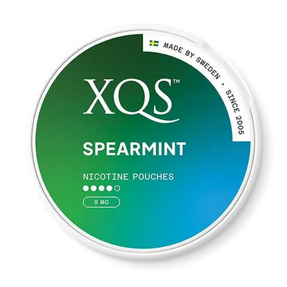 Close-up of XQS Spearmint all white nicotine pouch can. Slim format, spearmint taste, modern packaging.