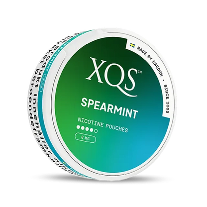 Close-up of XQS Spearmint all white nicotine pouch can. Slim format, spearmint taste, modern packaging.