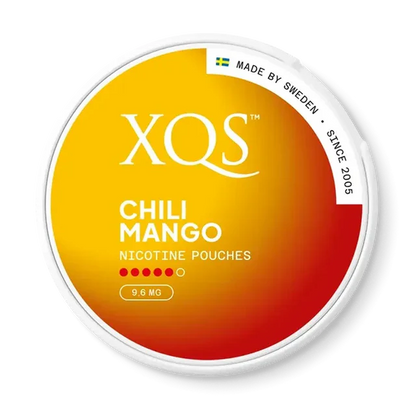 Close-up of XQS Chili Mango all white nicotine pouch can. Slim format, chili mango taste, modern vibrant packaging.