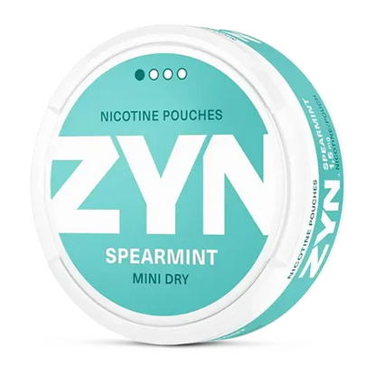ZYN Spearmint Mini Dry nicotine pouch can. Green and white design, all white mini pouch with dry spearmint flavor. Discreet and refreshing.