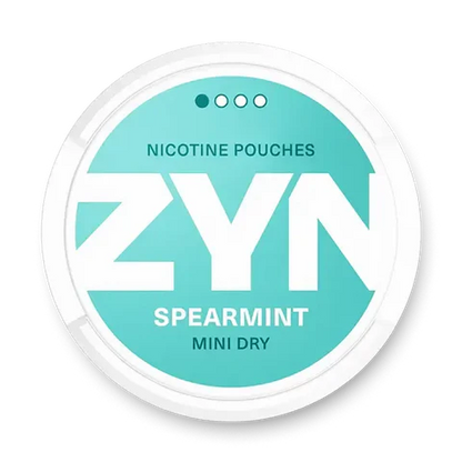 ZYN Spearmint Mini Dry nicotine pouch can. Green and white design, all white mini pouch with dry spearmint flavor. Discreet and refreshing.